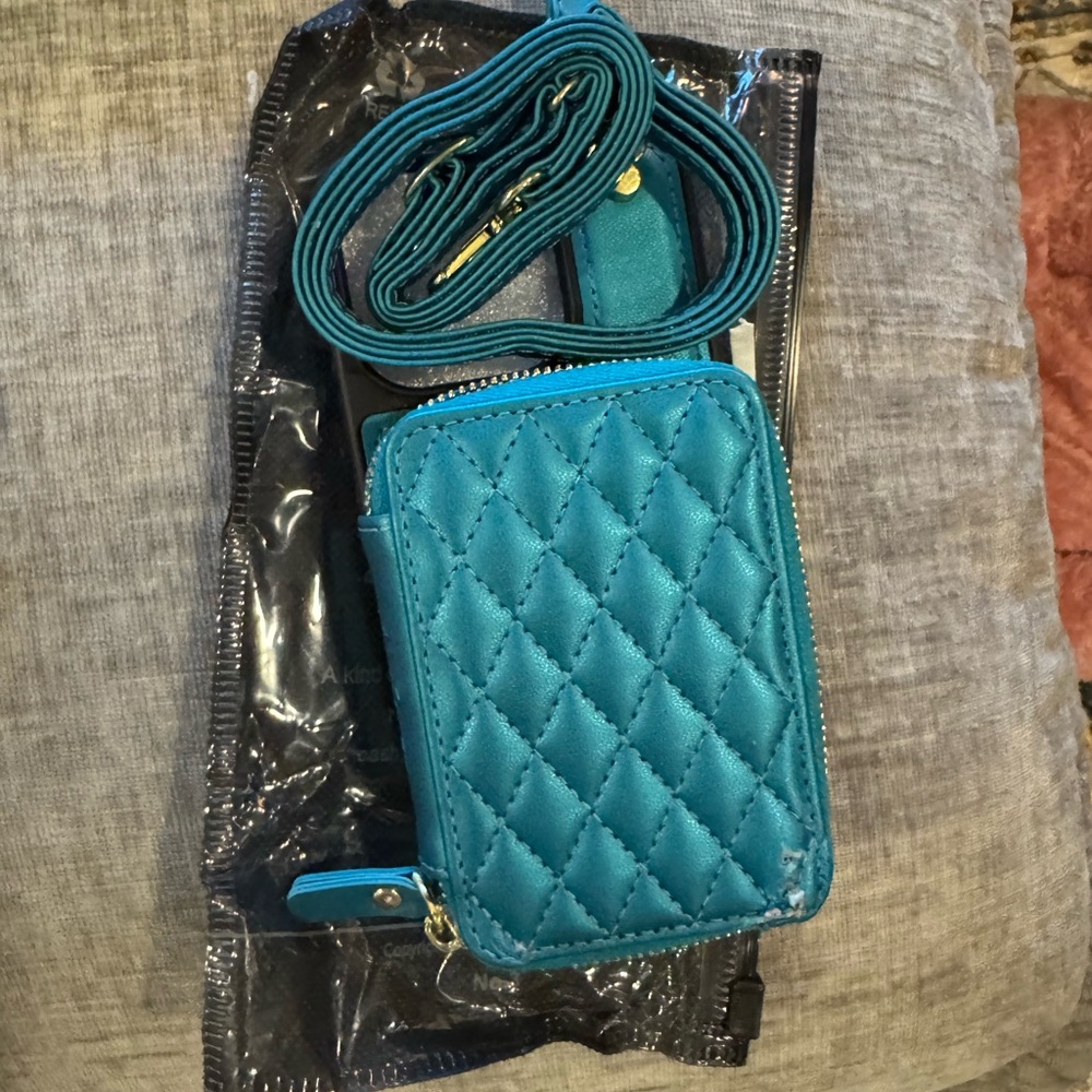 Quilted Teal Crossbody/wristlet. Right corner on wallet has a few blemishes